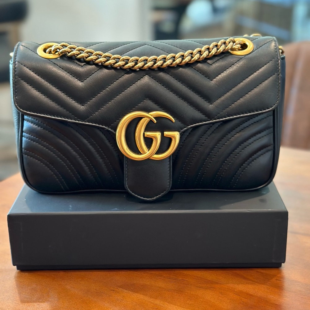 GG Marmont camera bag has a softly structured shape and a flap closure